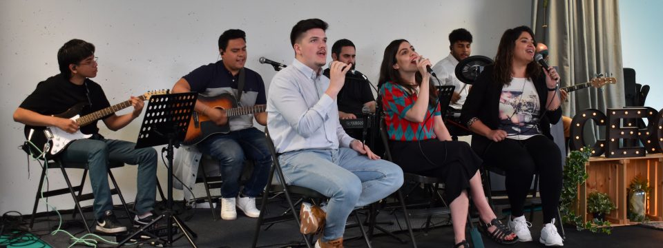 Iglesia CERO worship team leads in a song during the May 20 service in Madrid, Spain. [Photo: Marcos Paseggi, Adventist Review]