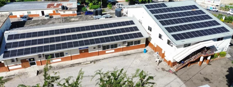 Aerial view of the installed solar panels atop the Willowdene Group of Schools roof in Spanish Town, St. Catherine, Jamaica. [Photo: Central Jamaica Conference]