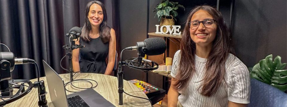 Podcast hosts news editor Juliana Muniz and associate editor Danelle Stothers recording Record Wrap’s pilot. [Photo: Adventist Record]