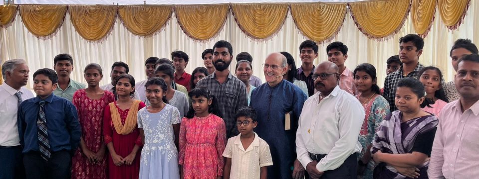 International evangelist Doug Batchelor (center right) poses for a group photo with some of the church members and their families who attended the revival meetings he led in Hyderabad, India. [Photo: courtesy of Abishek Deepati]