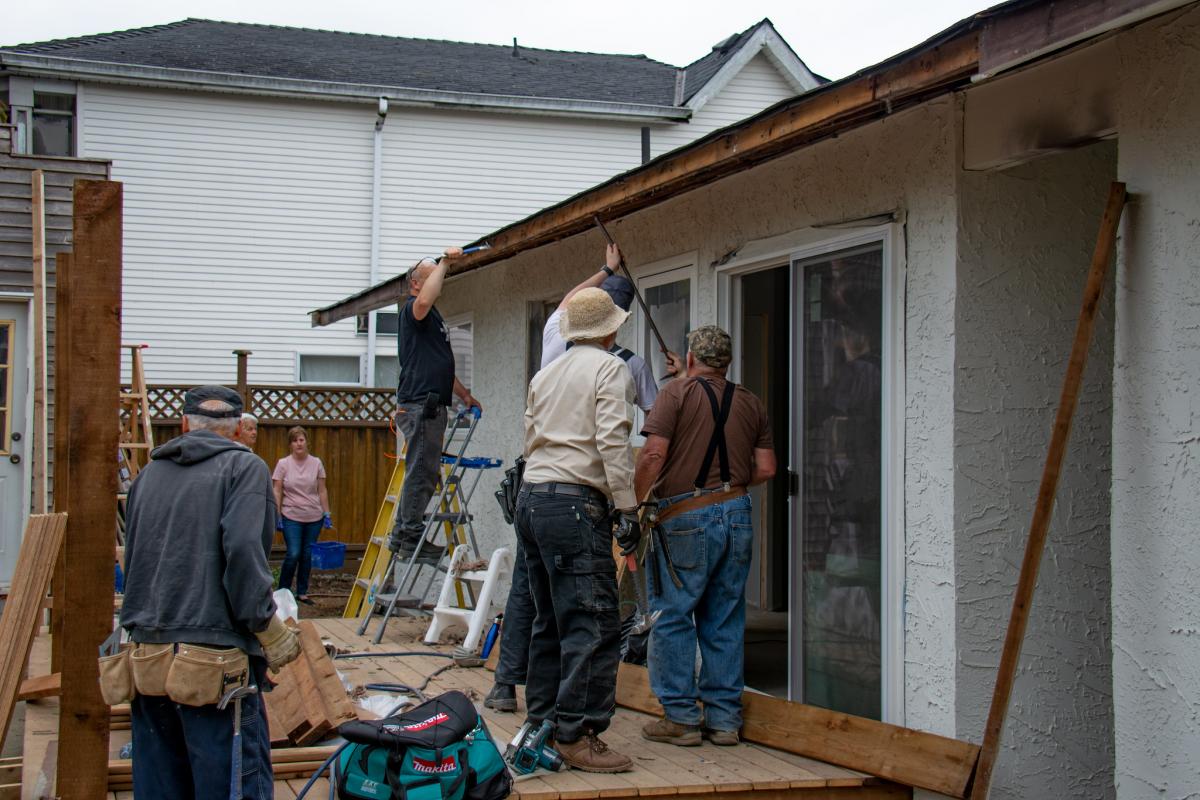 The Extreme Home Repair team works on its eighteenth project, the home of single mom Ledell Kendall in Aldergrove, British Columbia, Canada. [Photo: Church in the Valley Acts of Kindness]