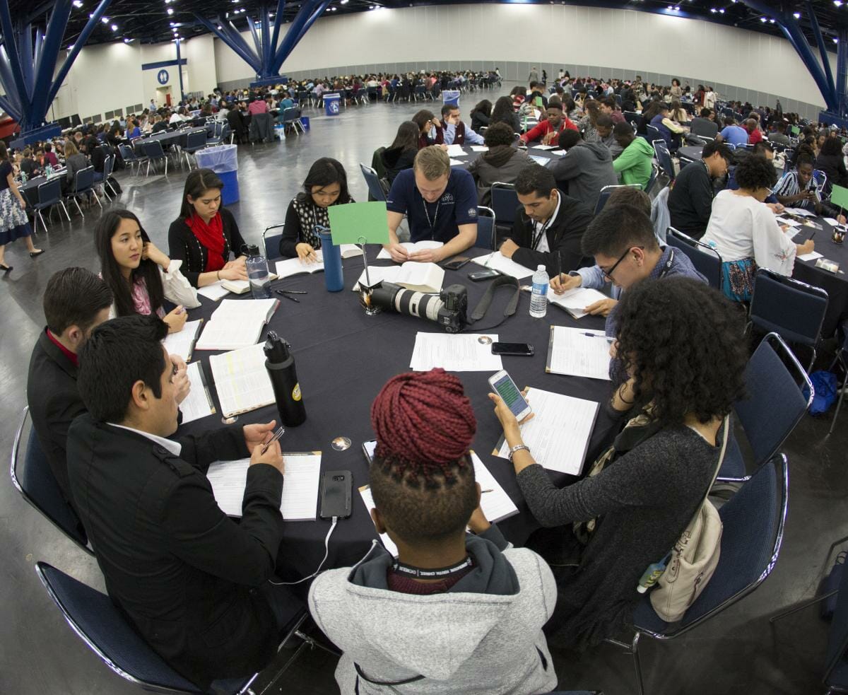 GYC attendees fill out the Activate booklet in groups during an evening session at the 2018 national conference in Houston, Texas, United States. [Photo: Seth Shaffer]