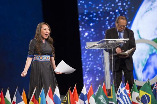 Tara Vang (left) shares her testimony, including details of her Hmong background, during the GYC 2018 national conference in Houston, Texas, United States. [Photo: Seth Shaffer]