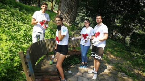 invasion of love volunteers paint a bench in the park