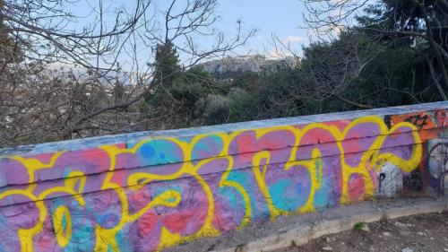 the acient acropolis contrasts with modern graffiti edited